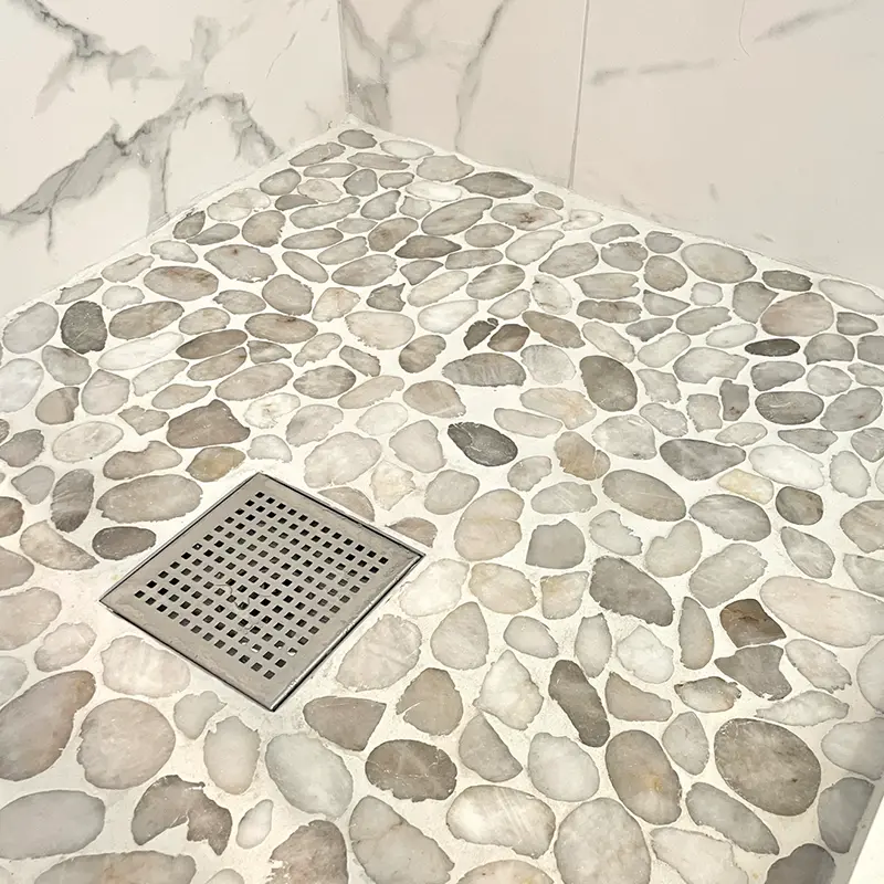 Stone mosaic shower floor